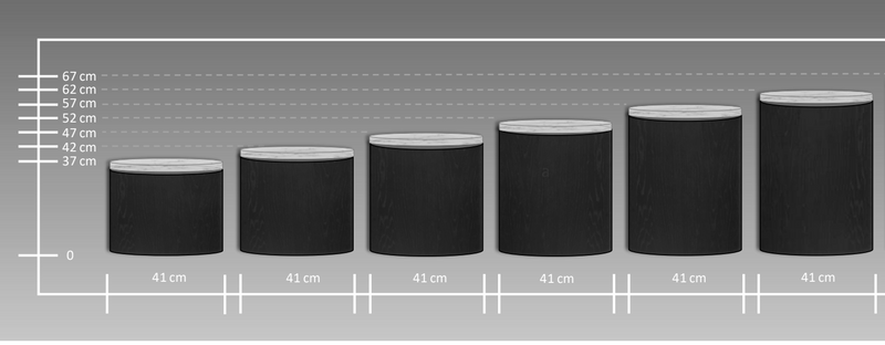Tabulkové zobrazení velikostí odkládacích stolků z mikrobetonu a dřeva, s měřením výšky v centimetrech. Stolky se pohybují od 37 cm do 67 cm na výšku, s jednotnými průměry 41 cm.