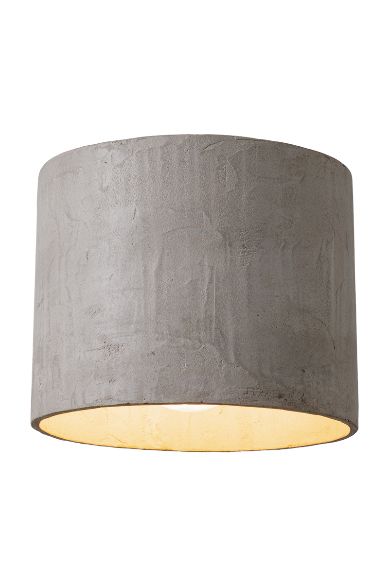 Stropní betonové svítidlo válcového tvaru v moderním industriálním stylu, bez difuzoru, s přímým směrovým světlem a minimalistickým designem vhodným pro obývací pokoj, kuchyň i kancelářské prostory.